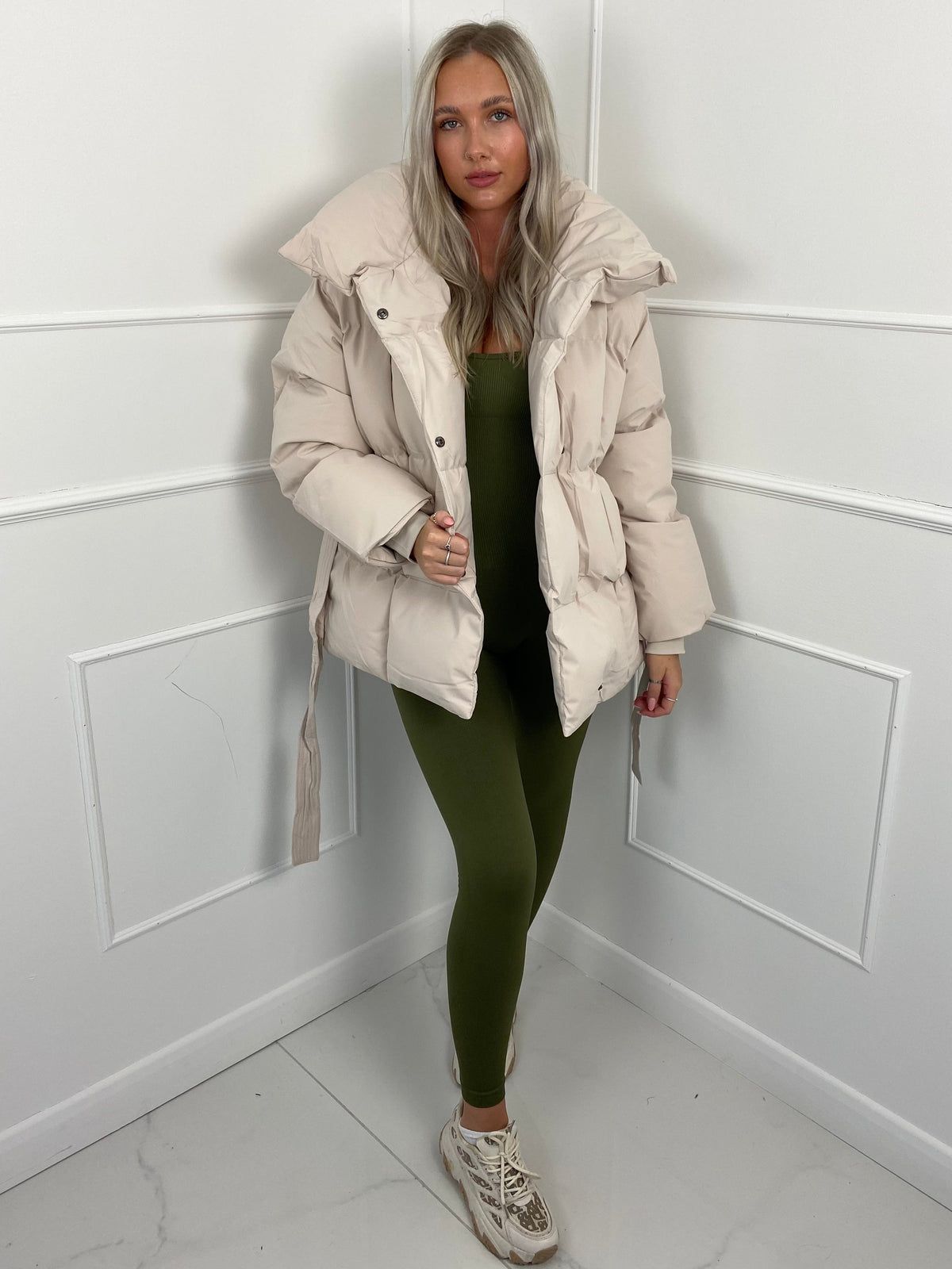 Women's belted puffer jacket, front view
