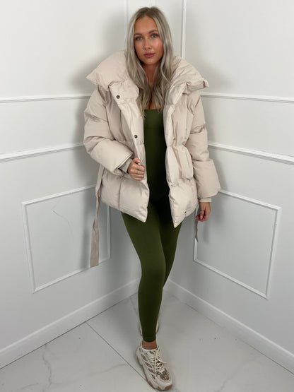 Women's belted puffer jacket, front view