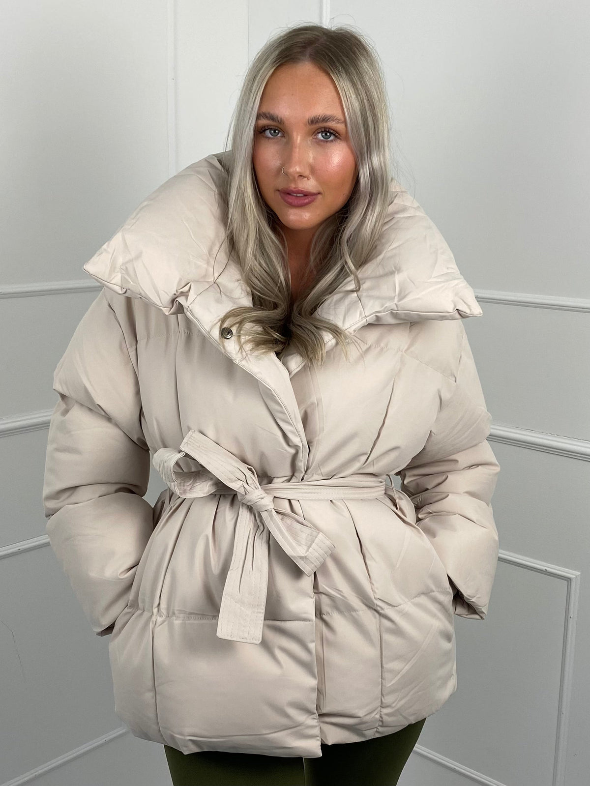 Women's belted puffer jacket, styled view