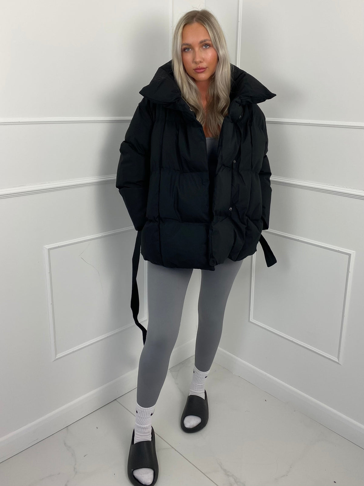 Women's belted puffer jacket, full length view