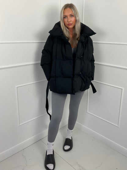 Women's belted puffer jacket, full length view