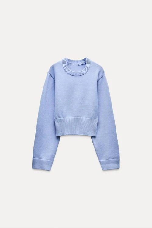 Women's crew-neck long sleeve jumper in light blue, side view