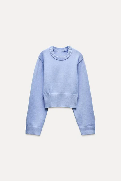 Women's crew-neck long sleeve jumper in light blue, side view