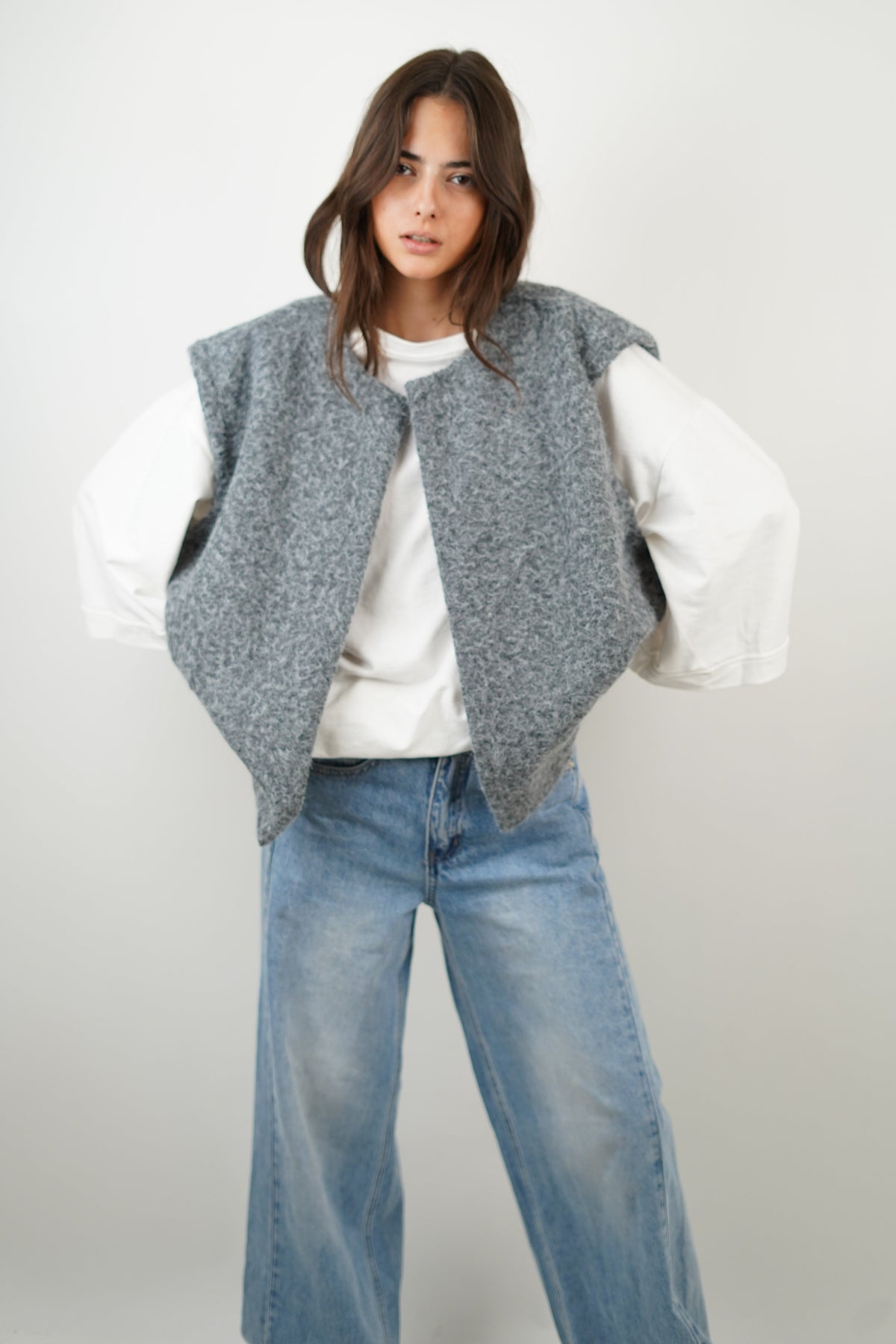 Women's crew neck modern vest in gray, side view