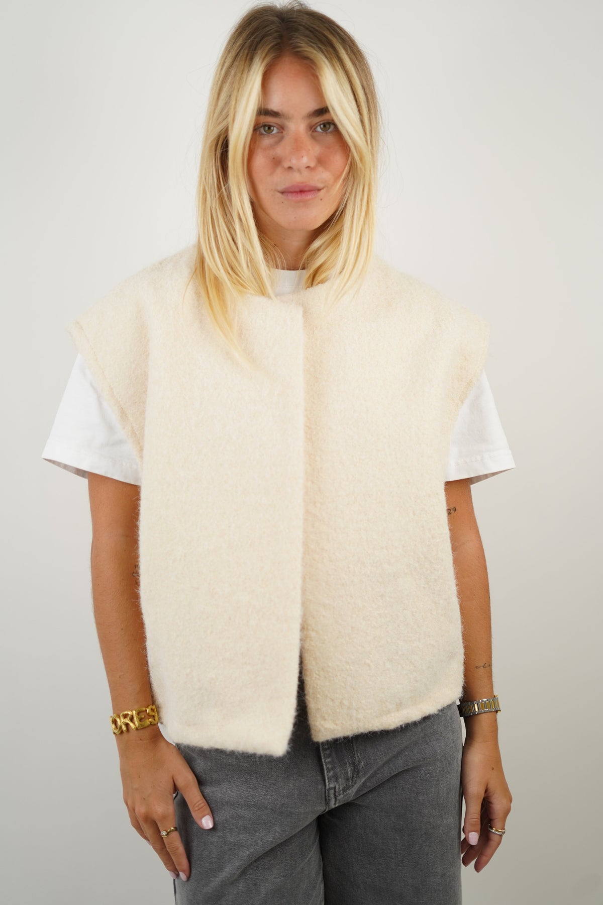 Women's crew neck modern vest in white, front view