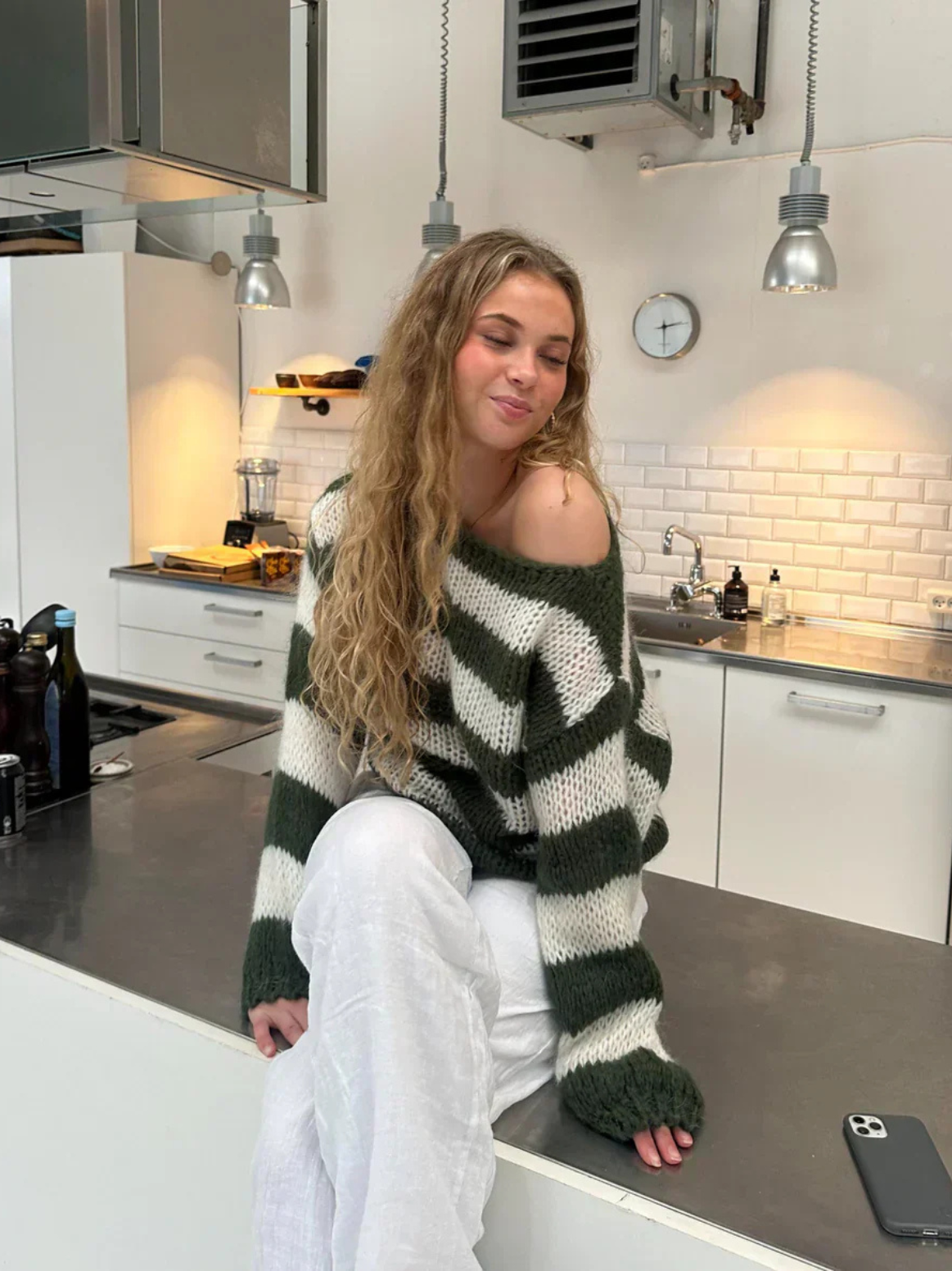 Women's crew neck striped top in green, side view