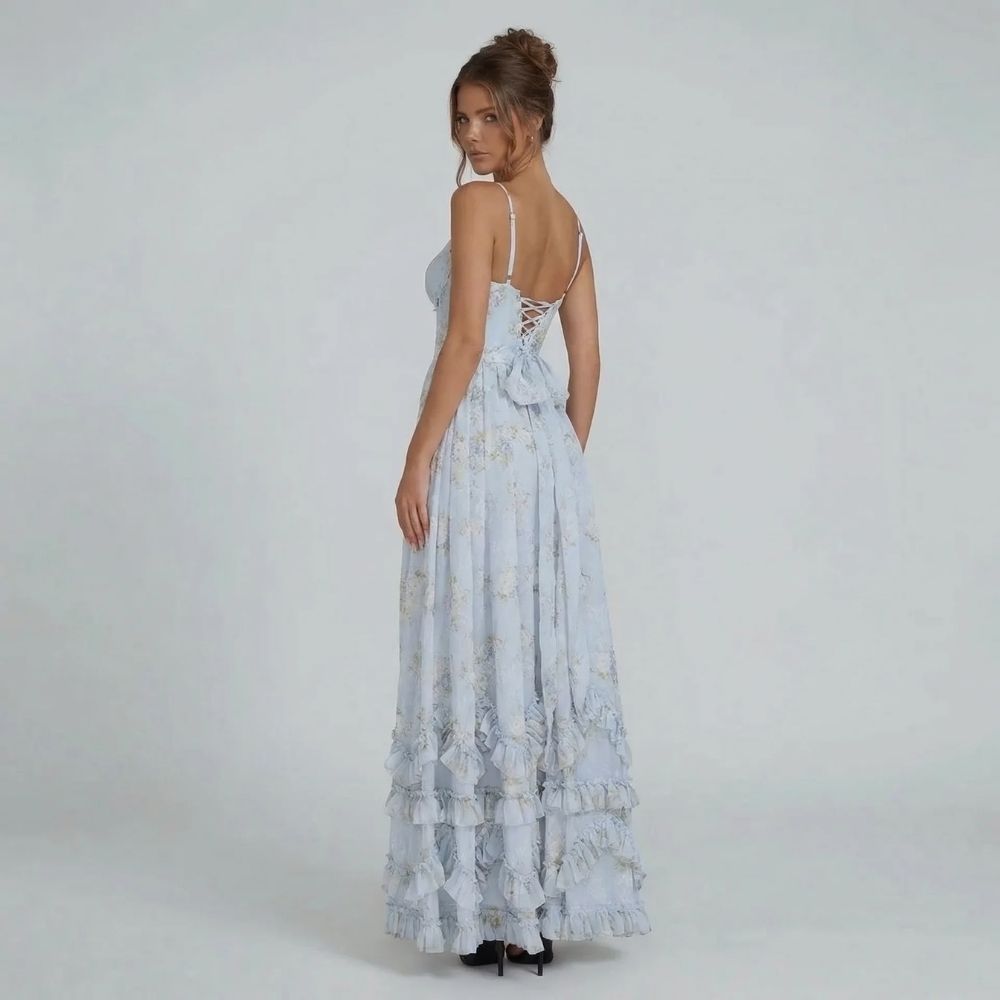 Women's floral corset tiered ruffle maxi dress in blue, back view with lace-up bow detail