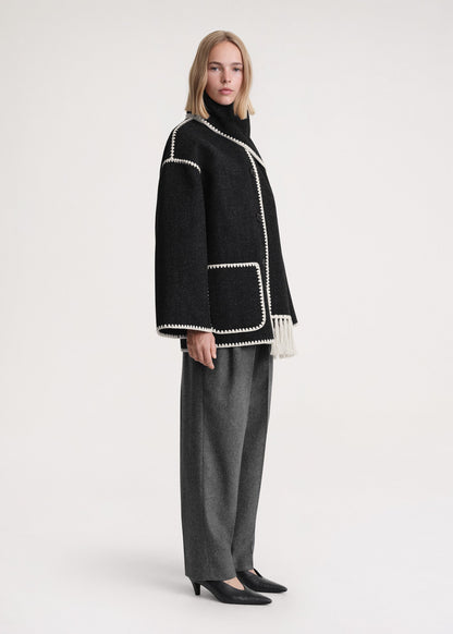 Women's formal high-neck wrap coat in black, side view