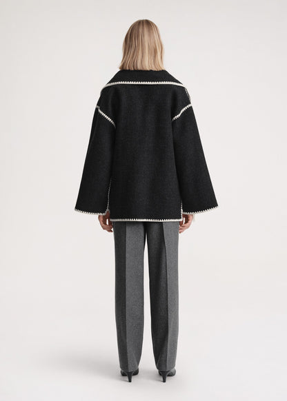 Women's formal high-neck wrap coat in black, back view