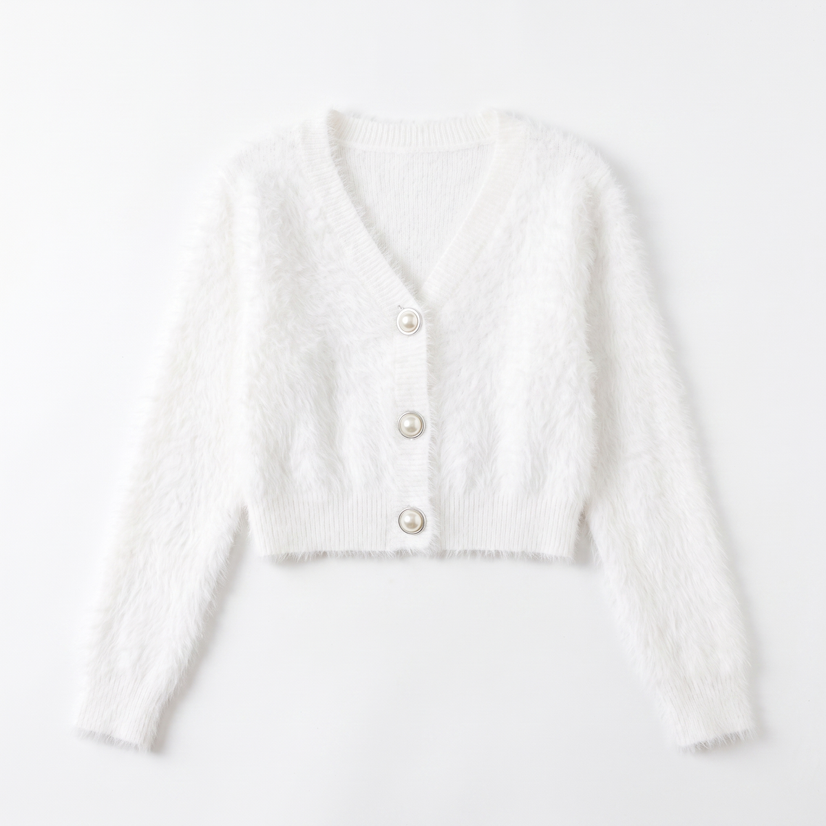 Women's fuzzy cropped pearl button cardigan in white, flatlay view