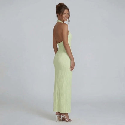 Women's halter wrap maxi dress in emerald green, open back view
