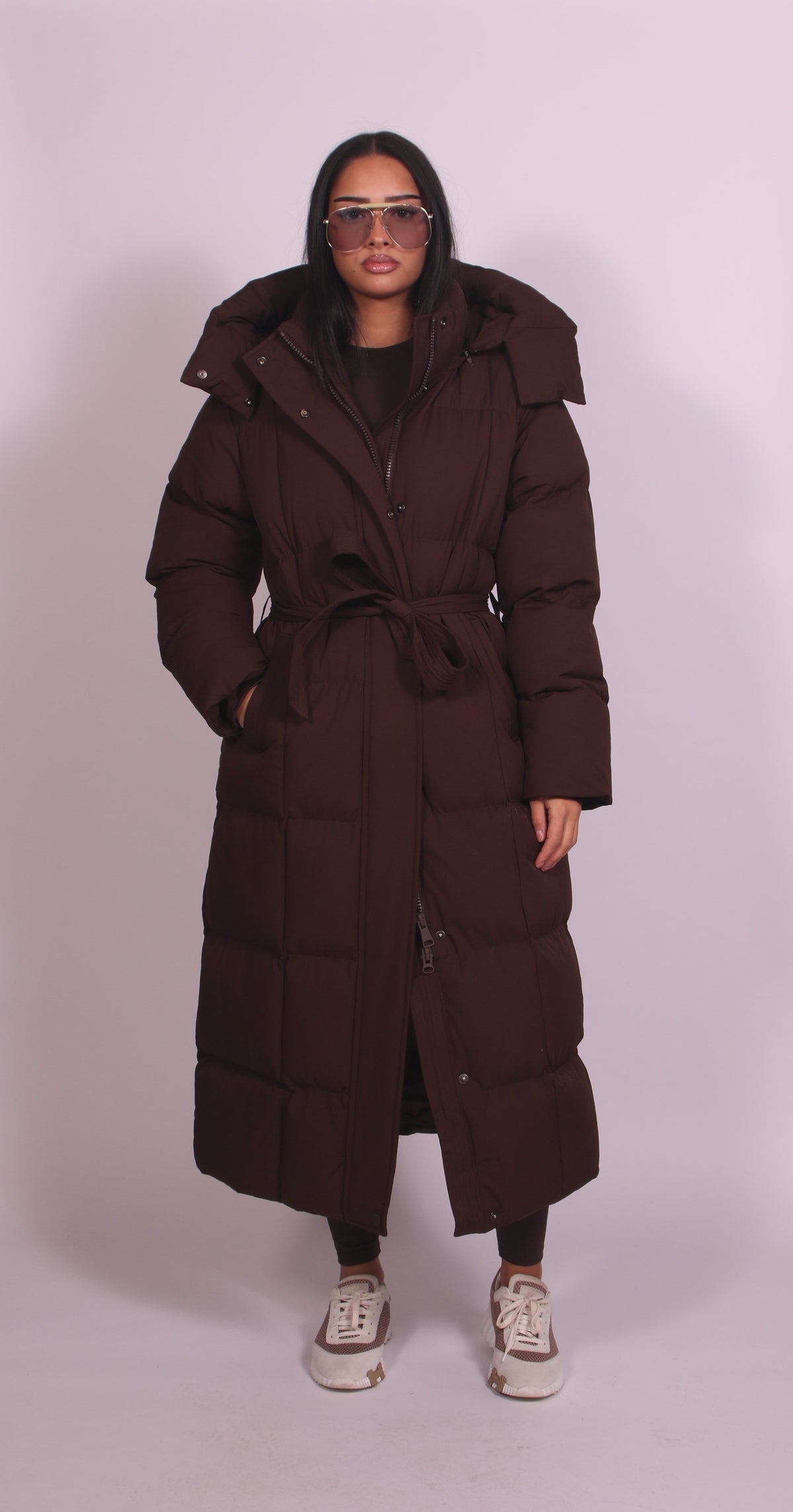 Women's hooded puff quilted coat in brown, front view