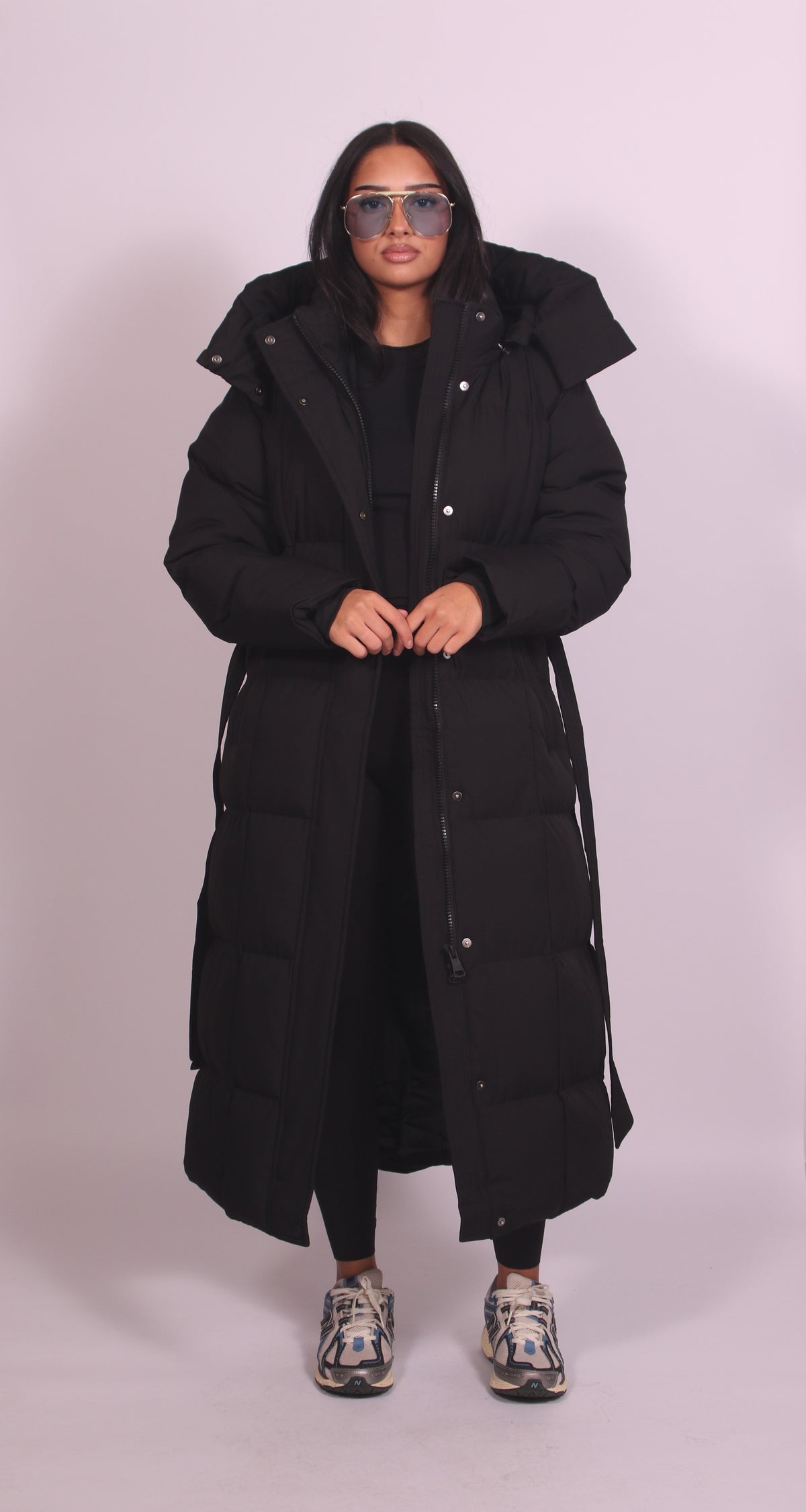 Women's hooded puff quilted coat in black, front view
