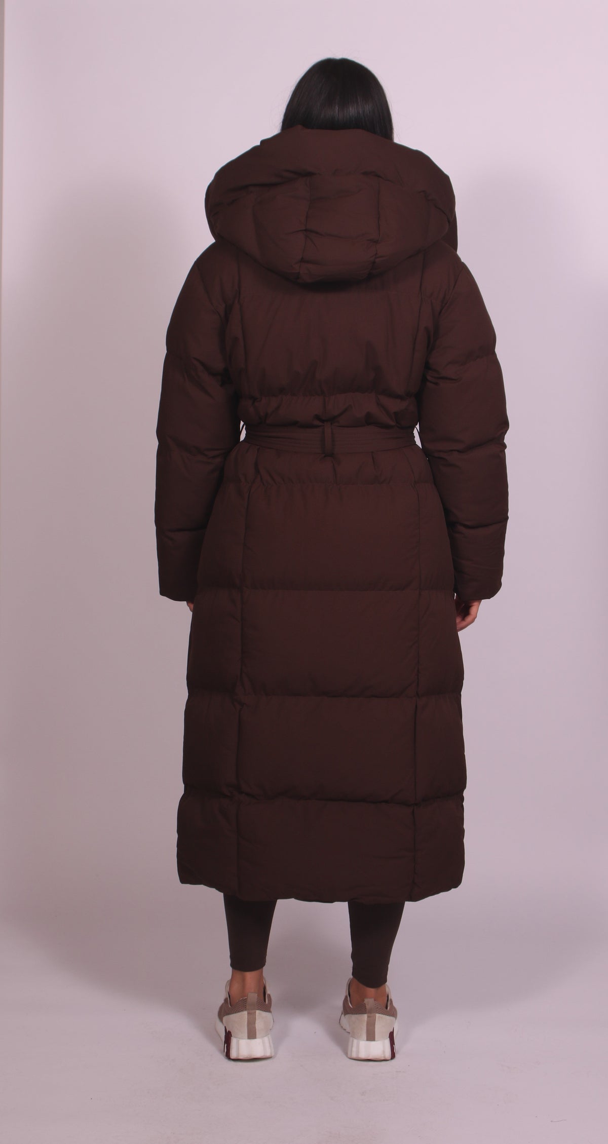 Women's hooded puff quilted coat in brown, back view