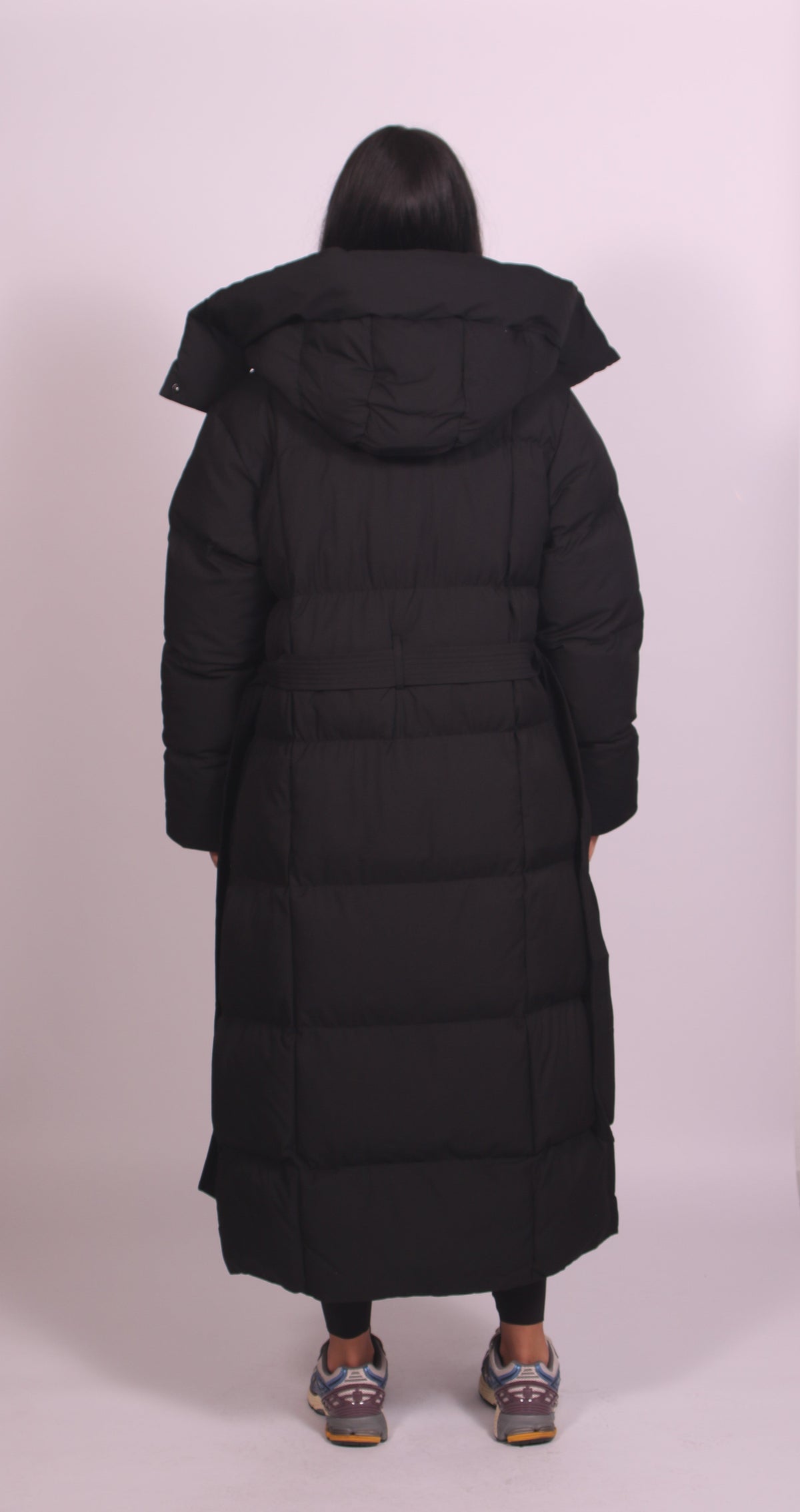 Women's hooded puff quilted coat in black, back view
