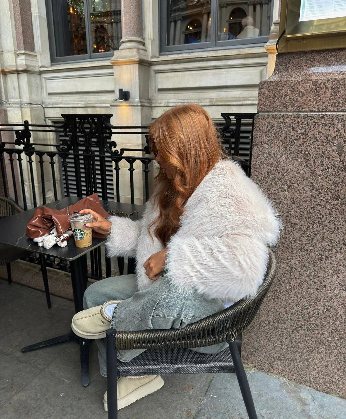 Women's oversized faux winter coat in gray, side view