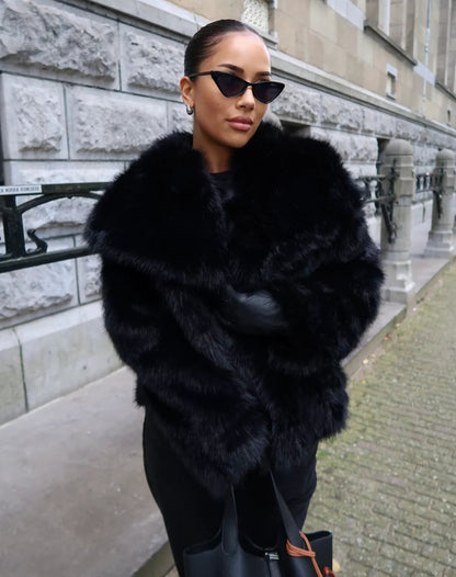 Women's oversized layering coat in black, side view