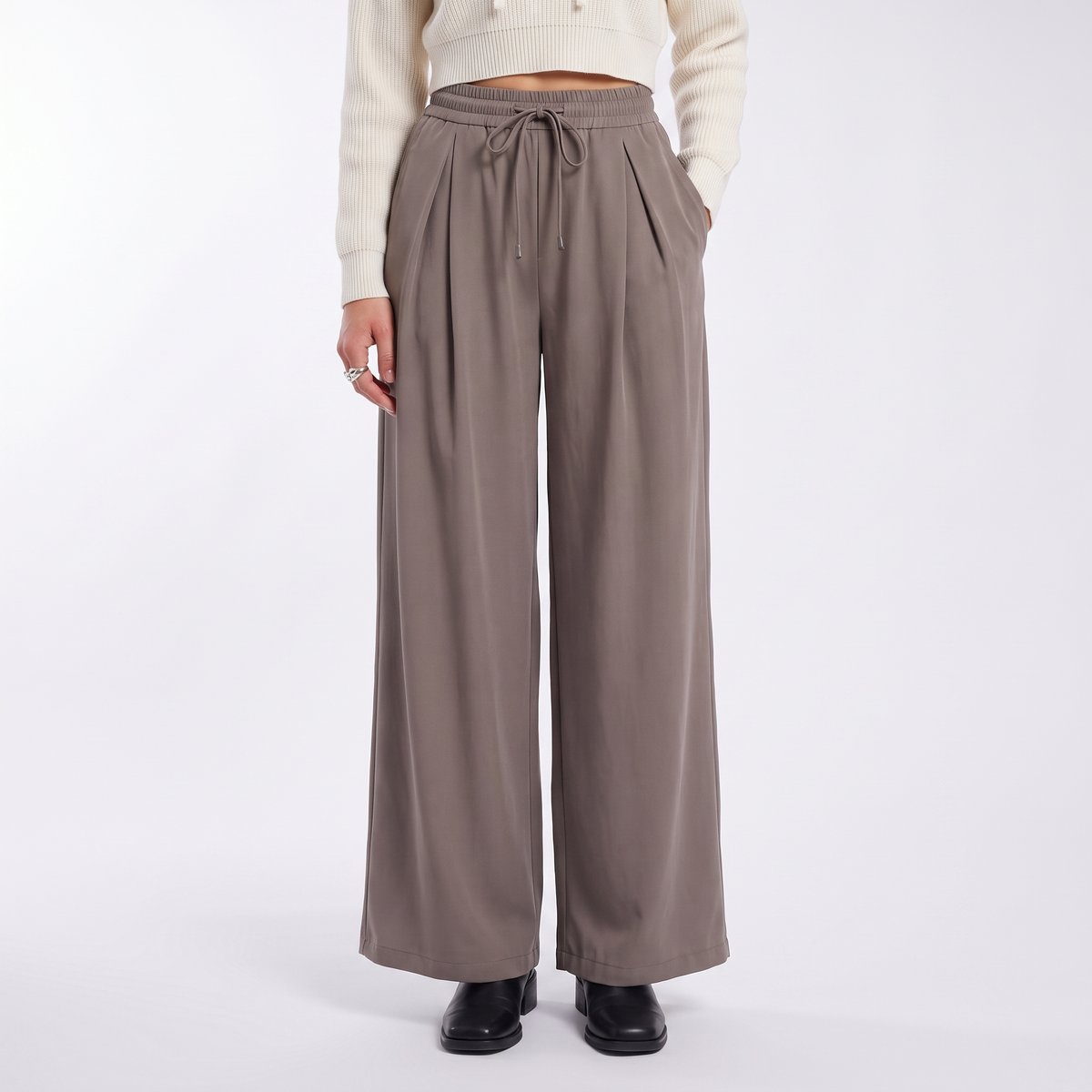 Women's pleated drawstring wide leg trousers in taupe, front view