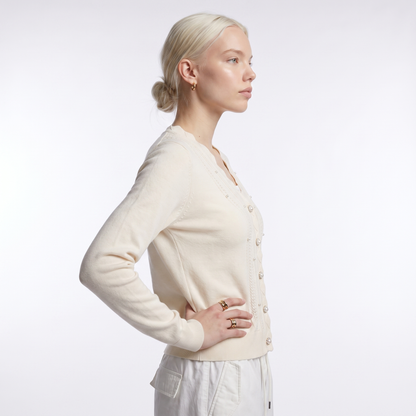 Women's scalloped v-neck pearl cardigan in cream, side view