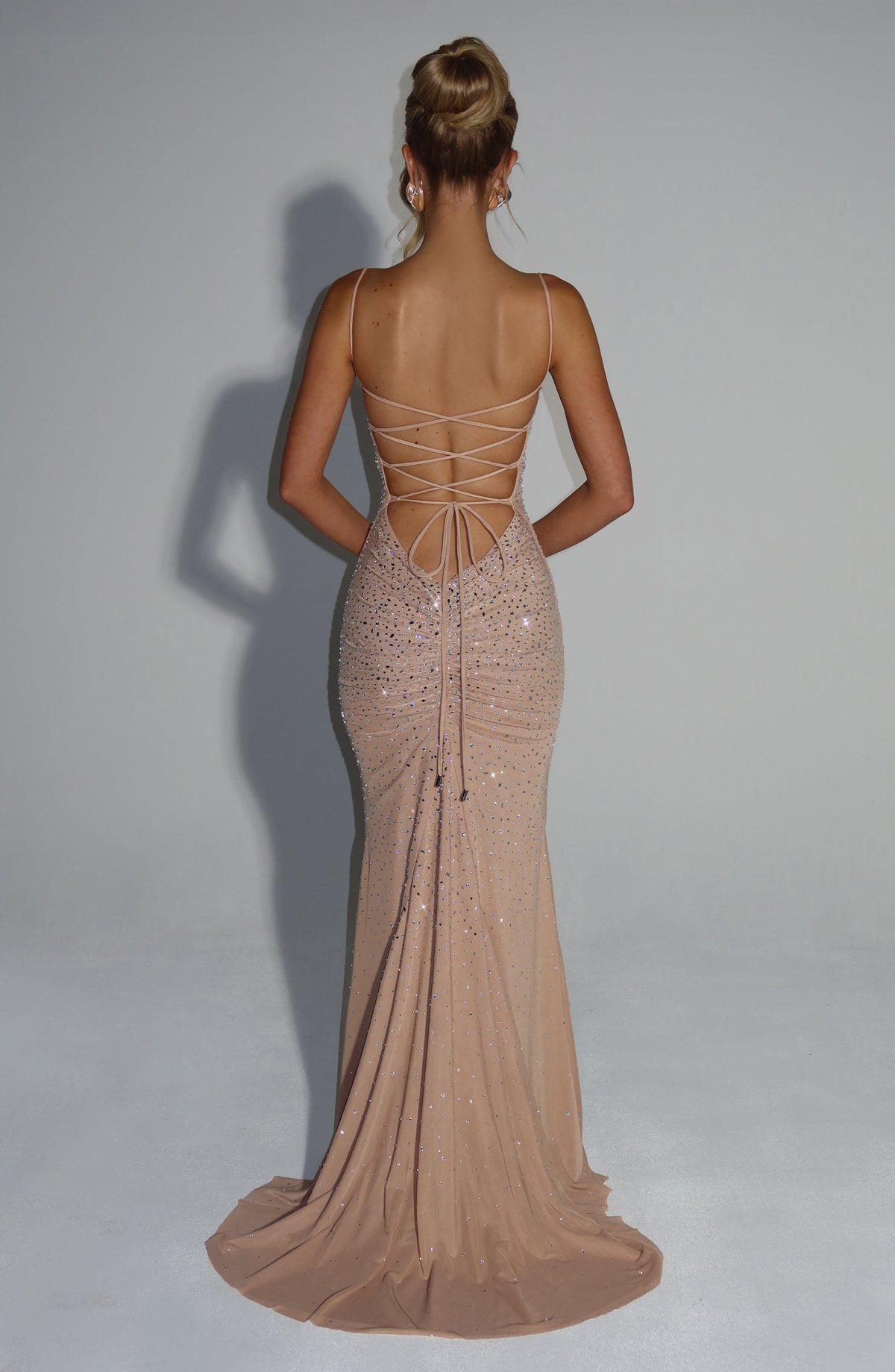 Women's wedding guest ruched maxi dress in nude, side view