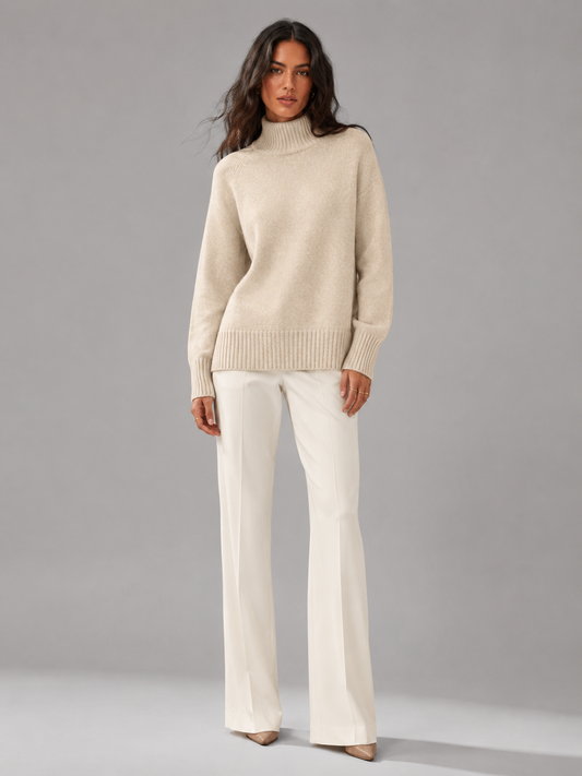 Women's oversized turtleneck jumper in beige, front view