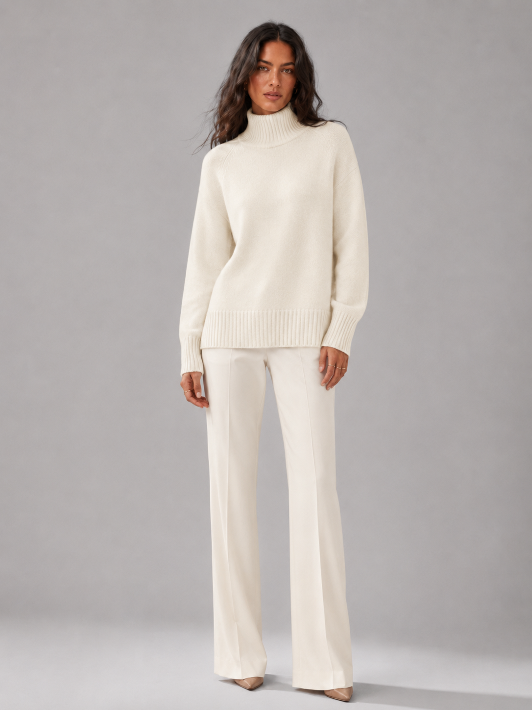 Women's oversized turtleneck jumper in white, front view